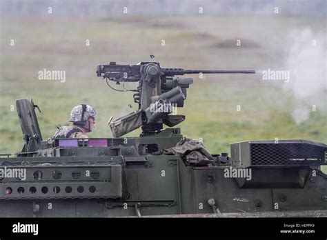 A Us Army Soldier Assigned To 2nd Stryker Brigade Combat Team 2nd Infantry Division Scans His