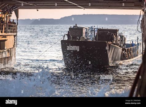 A Landing Craft Utility Enters The Well Deck Of The Amphibious Dock