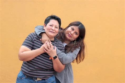 Married Latina Couple Cuddling Standing On The Beach Stock Photo Image Of Retired Elderly