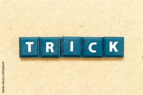 Tile alphabet letter in word trick on wood background Stock Photo ... 