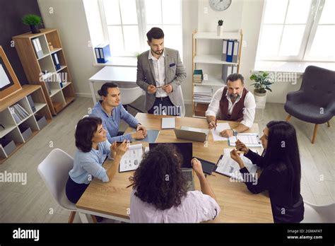 Business Team Having A Discussion In A Corporate Meeting Around The