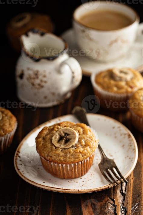 Banana muffins with coffee 15757994 Stock Photo at Vecteezy