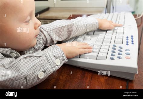 Happy Childhood Smart Little Boy Child Kid Playing On The Desktop