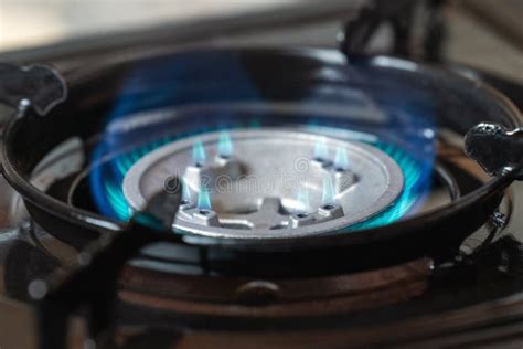 Portable Kitchen Gas Stove With A Burning Blue Flame Stock Image