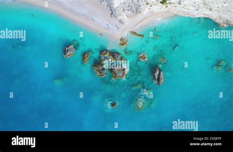 Aerial View Of Blue Sea Rocks In Clear Water White Sandy Beach Stock