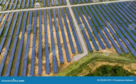 Aerial View Of Solar Power Plant On Green Field Solar Panels System