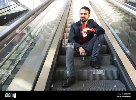 Man Sitting On Escalator Hi Res Stock Photography And Images Alamy