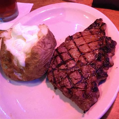 Texas Roadhouse ribeye steak with a baked potato (: it was delicious ...