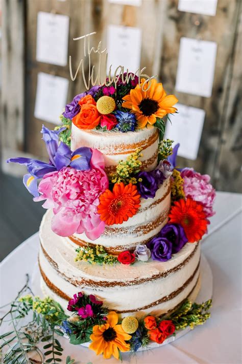 Naked Wedding Cake With Colorful Spring Flowers