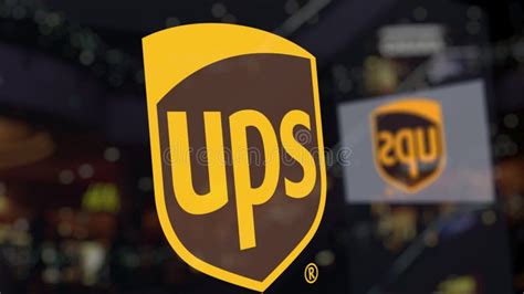 United Parcel Service UPS Logo on the Glass Against Blurred Business ...