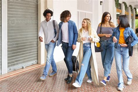 Multi Ethnic Group Of Friends Walking Together On The Street