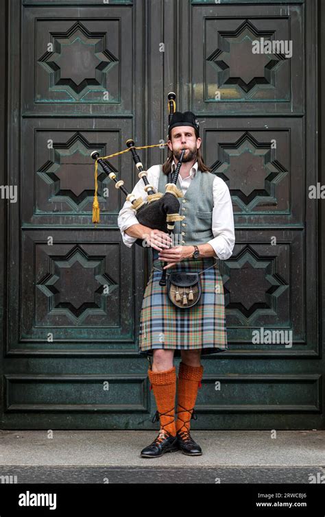 Bagpipe Playerwearing Kilt Busking Outside High Court Of Justiciary