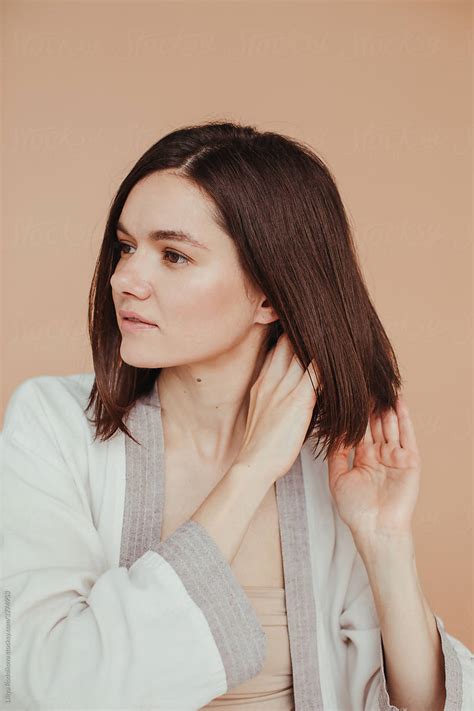 Brunette Model Apply Haircare Treatment By Stocksy Contributor Liliya Rodnikova Stocksy