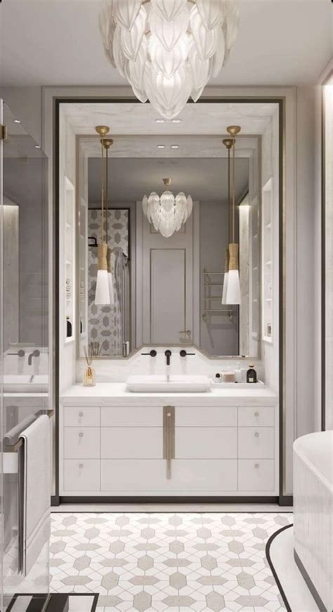 A White Bathroom With Chandelier And Bathtub