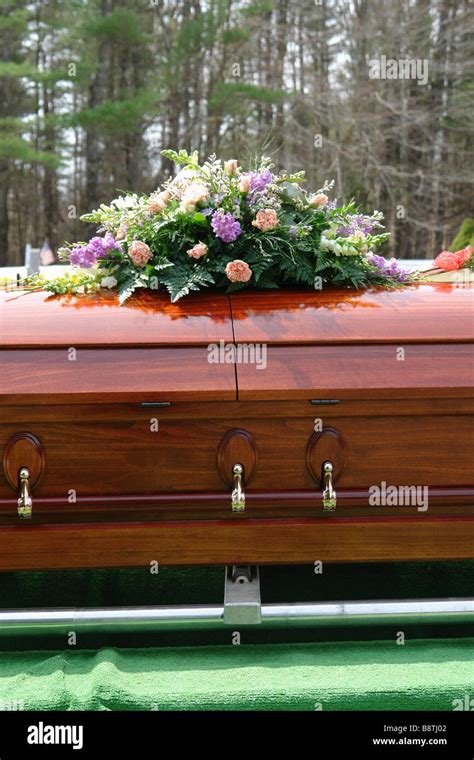 Wooden Casket And Flowers In A Cemetery Copy Space Stock Photo Alamy