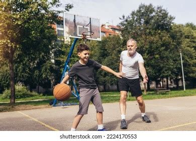 Mature Man Playing Basketball His Son Stock Photo 2224170553 Shutterstock