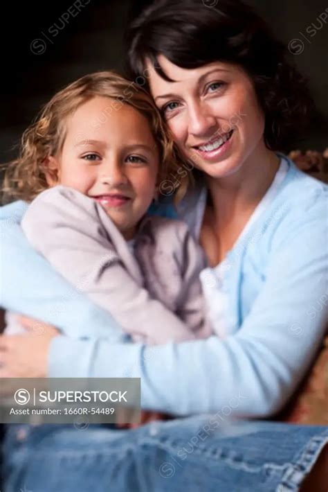 Mother And Daughter Smiling Superstock