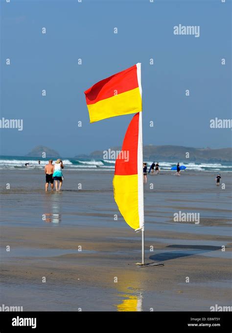 Lifeguard on duty flags Perranporth Cornwall England uk Stock Photo - Alamy