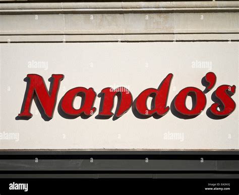 Nando`s Restaurant logo on outside wall in Manchester UK Stock Photo - Alamy