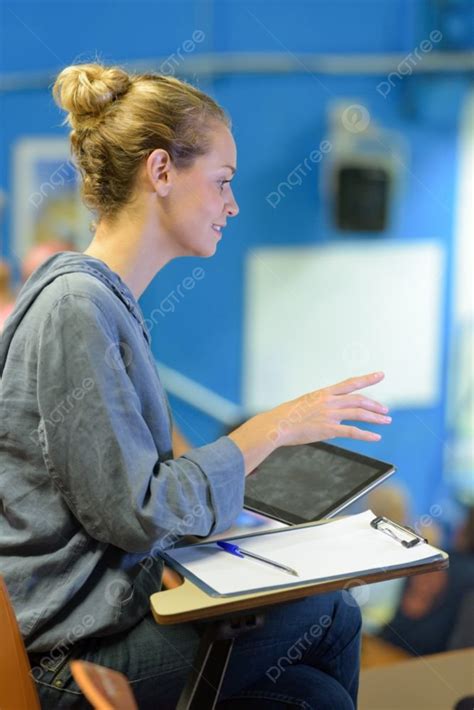 Woman Bidding In An Auction Hall Photo Background And Picture For Free