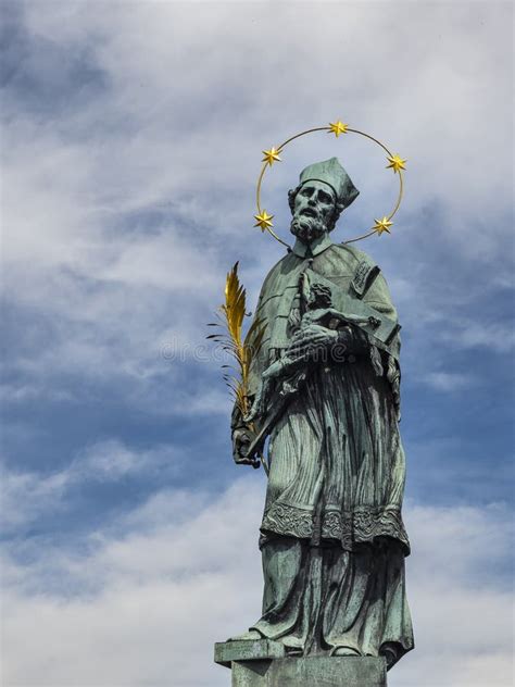 Statue Of St John Of Nepomuk On The Charles Bridge In Prague Stock