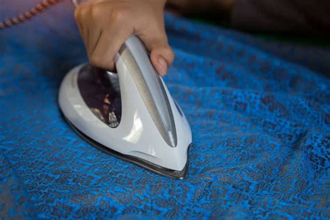 Men S Hands Holding Steam Iron Stock Image Everypixel