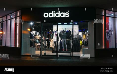 Adidas Store At Night In City Stock Photo Alamy