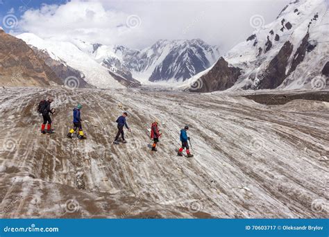 Mountaineers Walking Across Large Glacier Stock Image Image Of