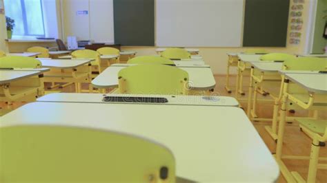 School Empty Classroom with White and Green Blackboard, Educational Yellow Desks and Chairs ...