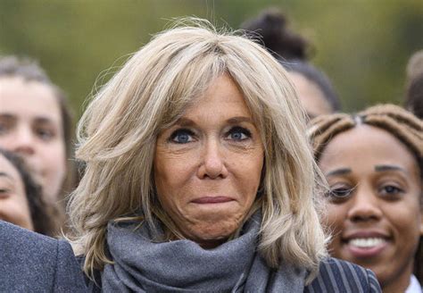 French First Lady Brigitte Macron Sharpens Up For Fall In Striped Coat