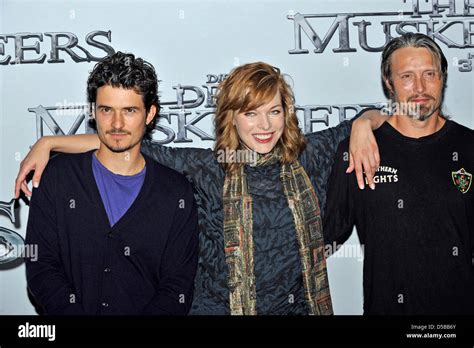 L R Orlando Bloom Milla Jovovich Mads Mikkelsen Arrive For A Press