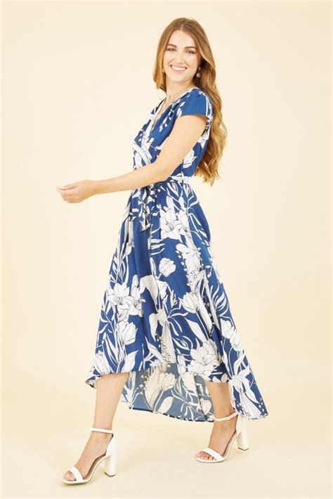 Mela Navy Leaf Print Dipped Hem Wrap Dress