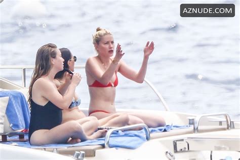 Amber Heard Enjoys A Day In A Red Bikini With Friends Aboard A Yacht On The Amalfi Coast Aznude