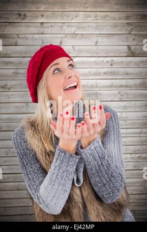 Cute Blonde In Winter Hat Sitting On Couch Posing Against Snow Falling Stock Photo Alamy