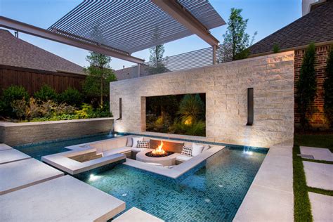 A Sunken Lounge A Cantilevered Deck And A Spa With A Fireplace Help