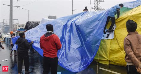 Undeterred By Cold Weather Rains Protesting Farmers Threaten To