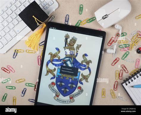 In this photo illustration, The University of Manchester logo seen ...