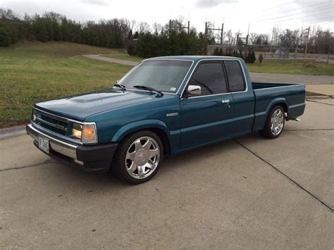 Blue Pickup Truck in a Parking Lot