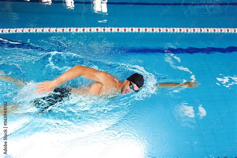 Man Swimmer Is Swimming In The Pool Freestyle Stroke Front Crawl