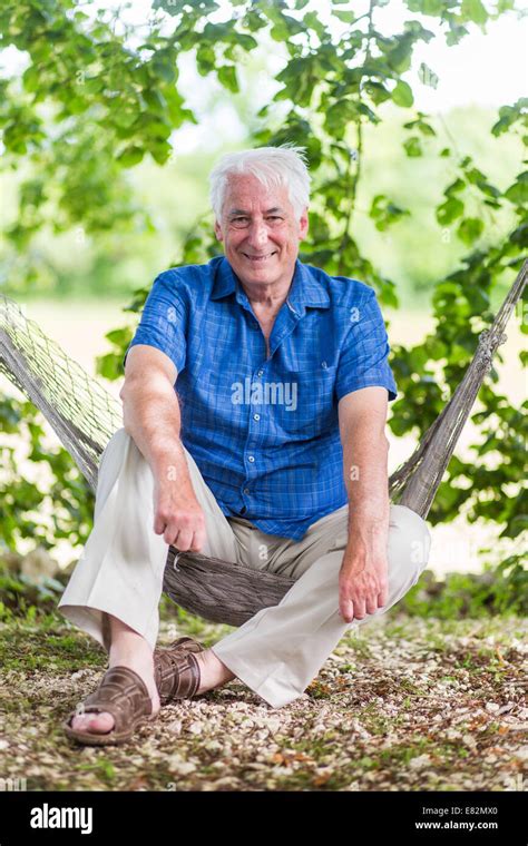 Man Resting In A Hammock Stock Photo Alamy