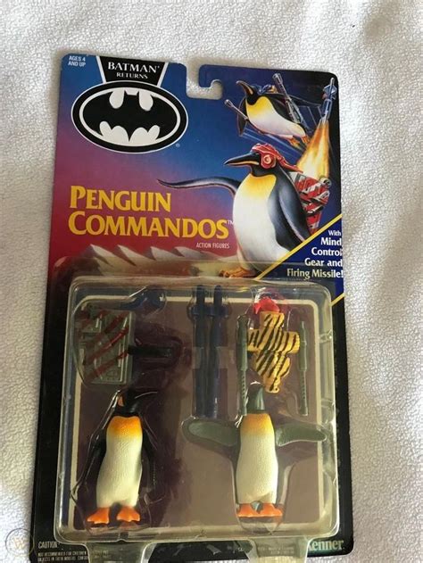 two penguins are in the packaging for batman movie characters, one is ...