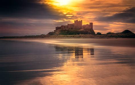 Castle Near Body of Water Under Golden Hour · Free Stock Photo