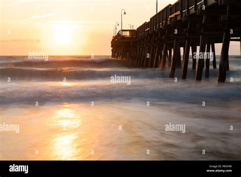 The waves splash along the Sandbridge Fishing Pier in Sandbridge ...