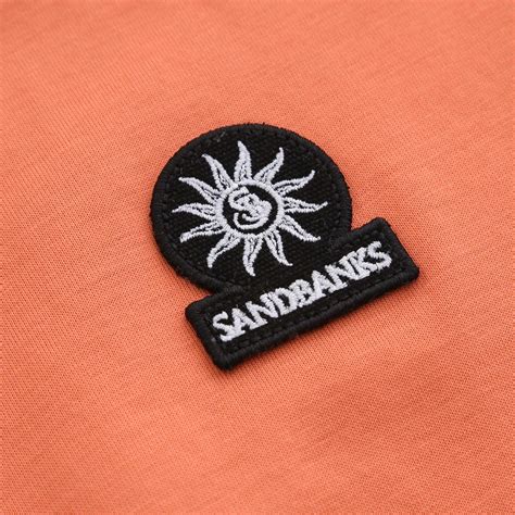 Sandbanks Badge Logo T Shirt in Coral | Sandbanks – Norton Barrie