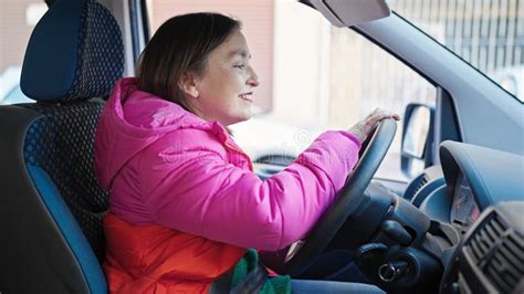 Mature Hispanic Woman With Grey Hair Smiling Confident Driving Car At Street Stock Image Image