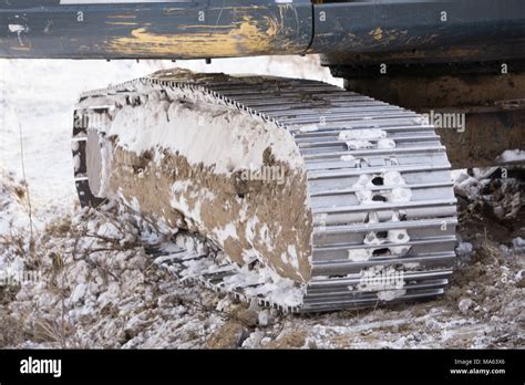 caterpillar from bulldozer on frozen ground to work Stock Photo - Alamy