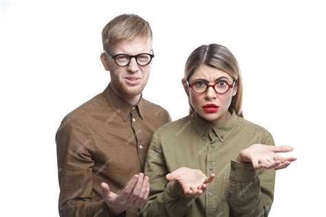 Free Photo Two Employees Wearing Eyeglasses Having Displeased Expressions Grimacing And