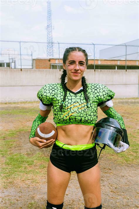 Portrait of mexican woman american football player wearing uniform with ...