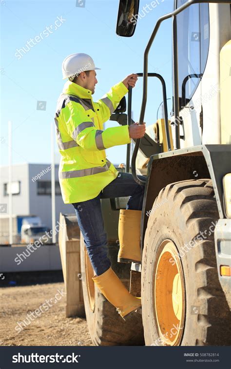 Construction Worker Climbing Wheel Loader Stock Photo 508782814 ...