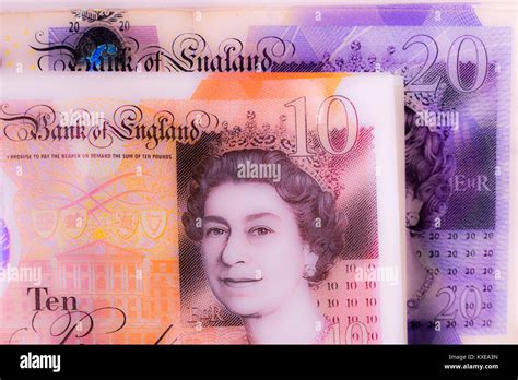 New £10 Notes Ten Pounds With £20 Notes Behind Sterling Pound